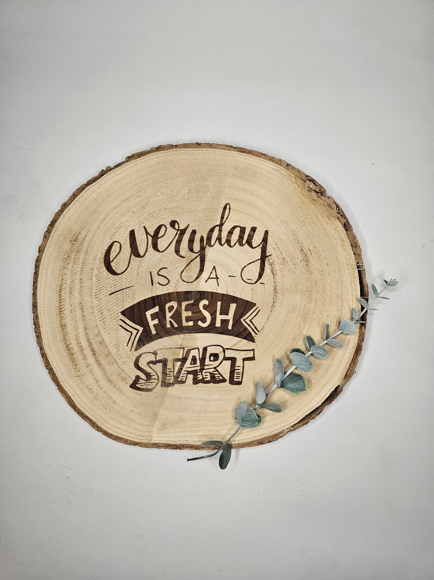 Holzscheibe mit Spruch